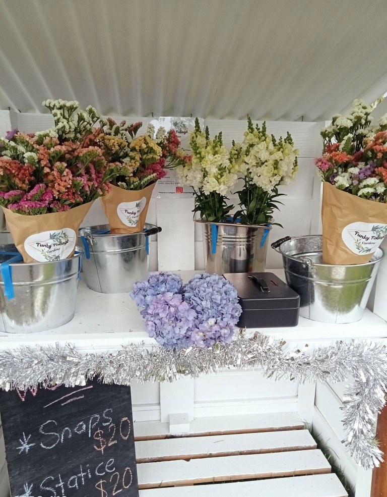Wrapped bunches and hydrangea on the farm stand